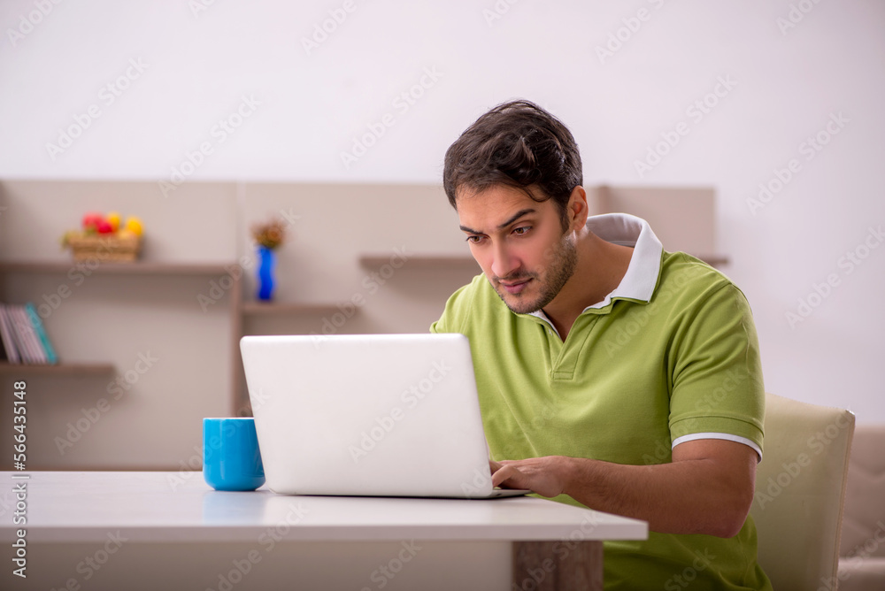 Young man working from home during pandemic Young man working from home during pandemic