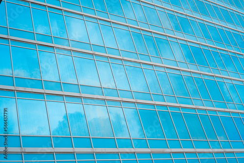 Sky and clouds reflection in the windows of modern skyscraper
