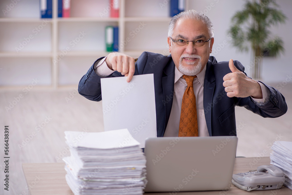 Old male employee and too much work in the office Old male employee and too much work in the office