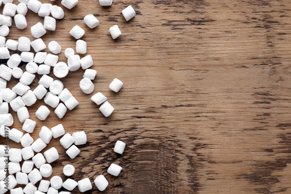 Delicious marshmallows on wooden table, flat lay. Space for text Delicious marshmallows on wooden table, flat lay. Space for text