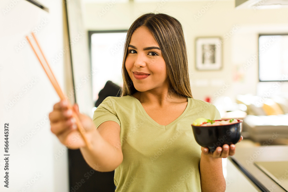 pretty latin woman having a ramen noodles bowl pretty latin woman having a ramen noodles bowl