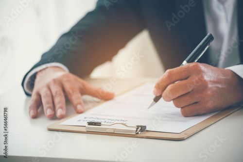 Close up manager businessman hands sign contract working meeting. Asian business man using pen signing on new contract to starting projects in conference room.  Business agreement concepts.