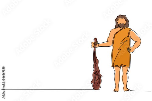 Single one line drawing caveman standing and holding big cudgel. Prehistoric bearded man dressed in animal pelt. Neanderthal hunter. Ancient homosapiens. Continuous line draw design graphic vector