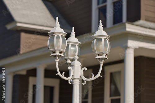 Classic charm of white retro street lamps in front of a house
