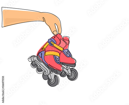 Single one line drawing player hand holds rollerblade. Man hand holding pair of old retro plastic inline skates shoes. Vintage classic extreme sport. Continuous line draw design vector illustration
