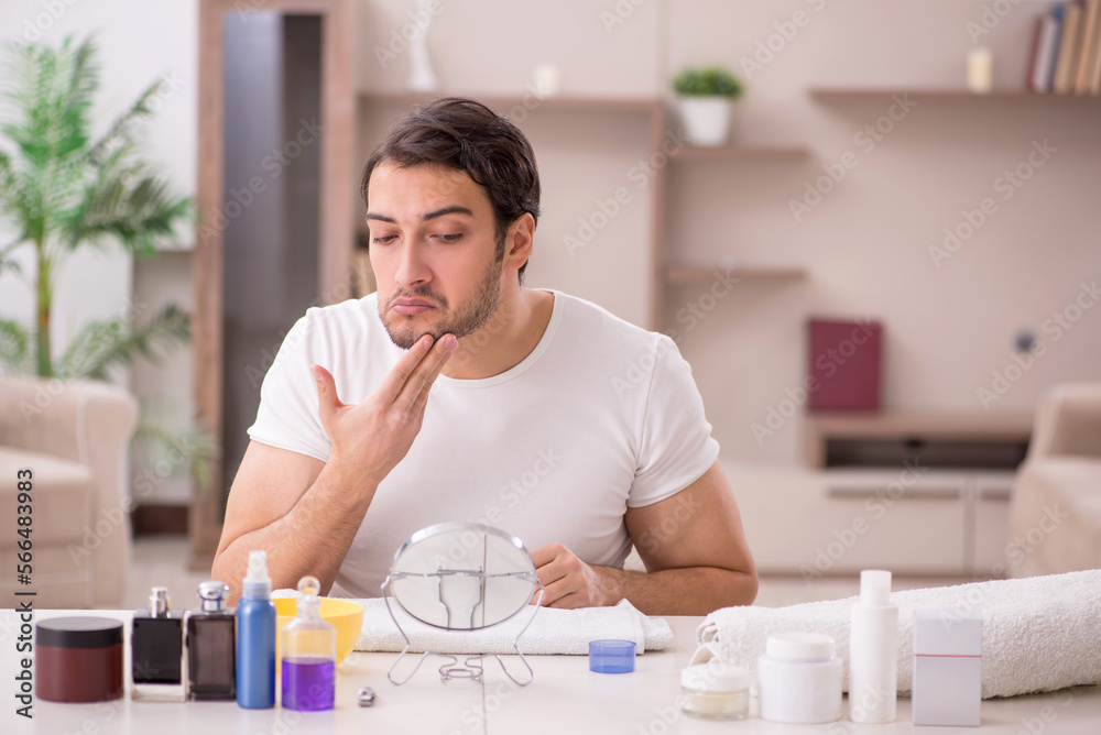 Young man shaving face at home Young man shaving face at home