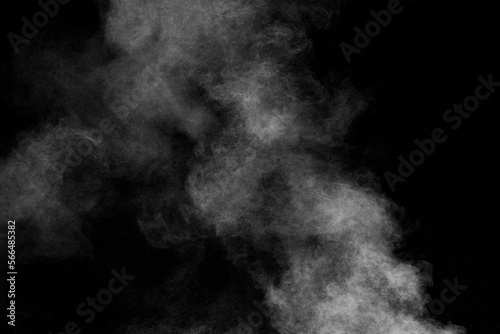 White dust cloud in the air.Abstract white powder explosion against black background.