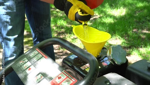 pouring fuel before pressure washing preparation photo