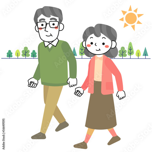日光を浴びながら緑の中を散歩するシニア夫婦