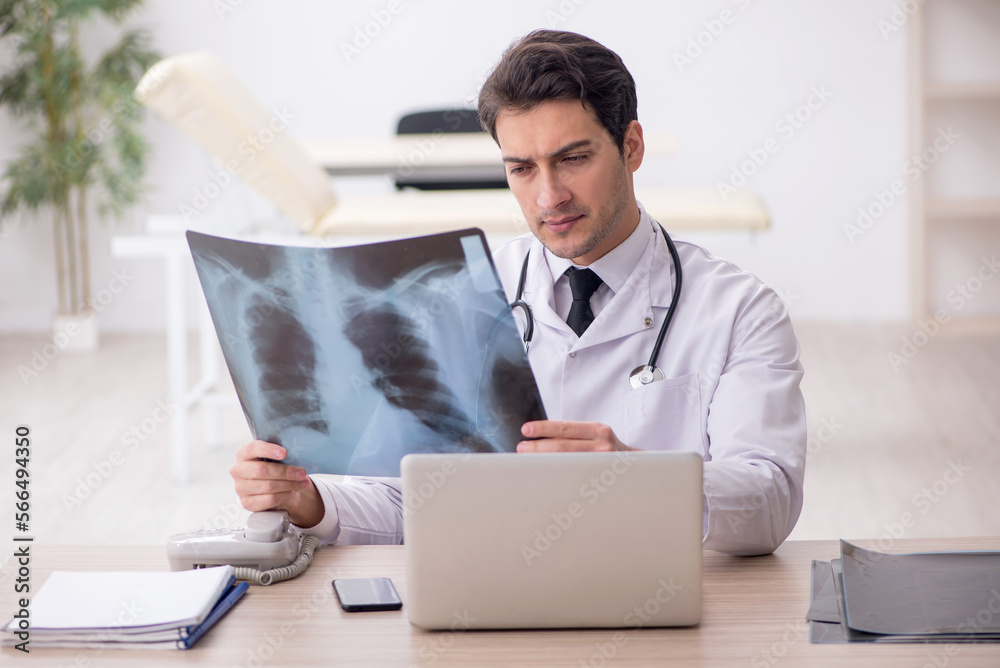 Young male doctor radiologist working in the clinic Young male doctor radiologist working in the clinic