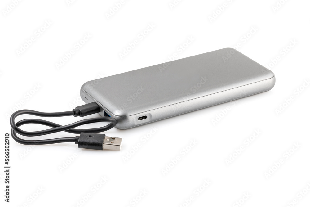 Additional autonomous power bank for charging mobile devices. External battery isolated on white background. Silver charger for a smartphone with a power supply (battery). Full depth of field. Additional autonomous power bank for charging mobile devices. External battery isolated on white background. Silver charger for a smartphone with a power supply (battery). Full depth of field.