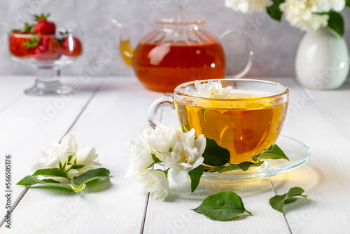 Jasmine tea in a cup on a wooden background. Copy space