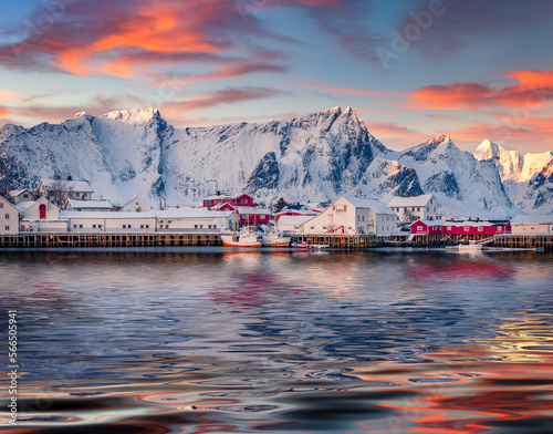 Small fishing town Hamnoy reflected in the calm waters of Norwegian sea. Superb morning scene of , Norway, Europe. Iconic landscape of Lofoten Island. Traveling concept background.. photo