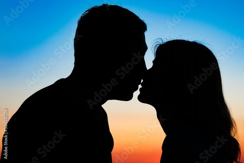 happy couple silhouette against a sunset romance