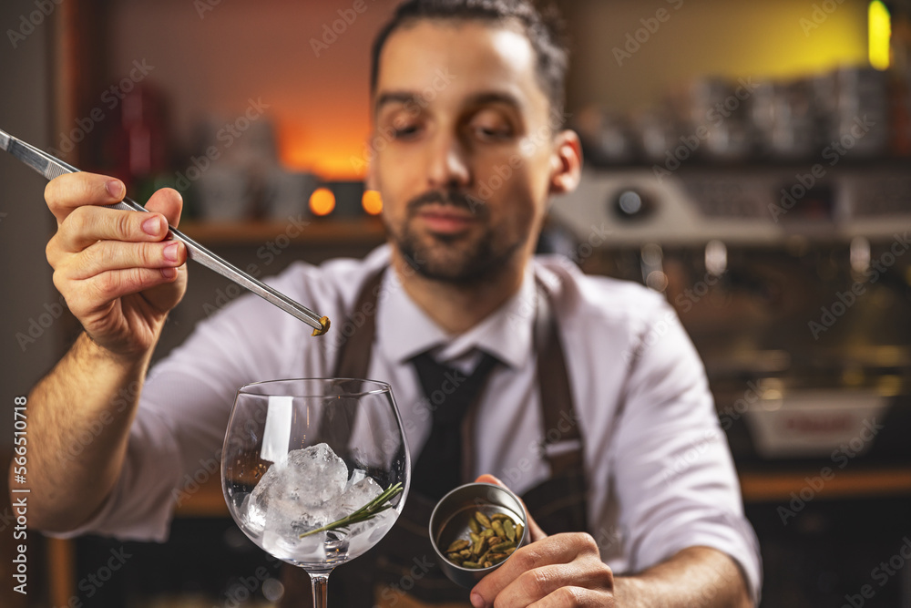 Expert barman is making cocktail Expert barman is making cocktail
