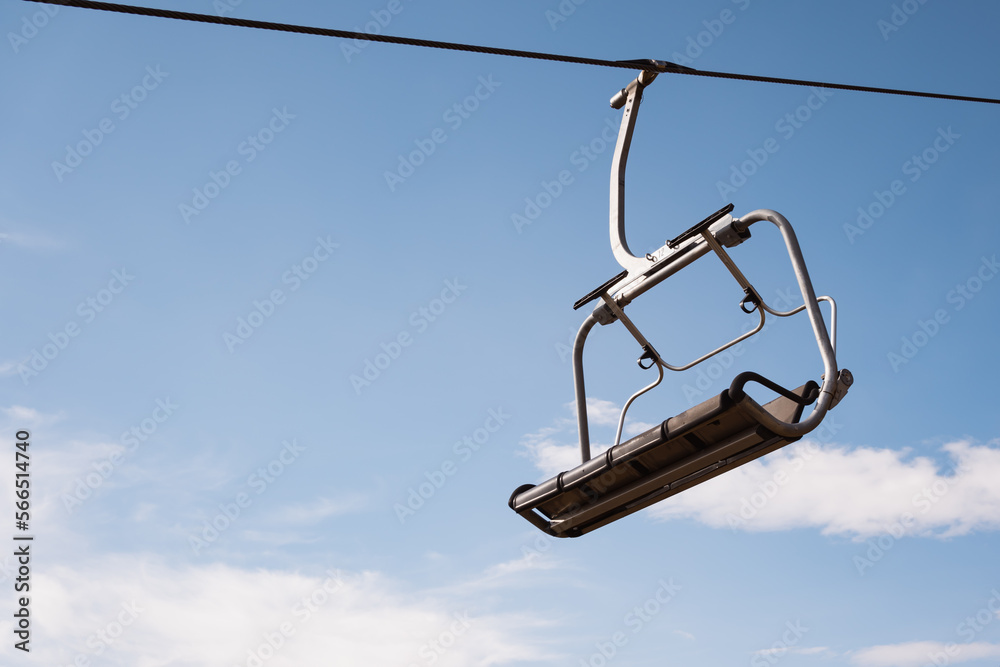 Empty chairlift with sky background in mountains Empty chairlift with sky background in mountains