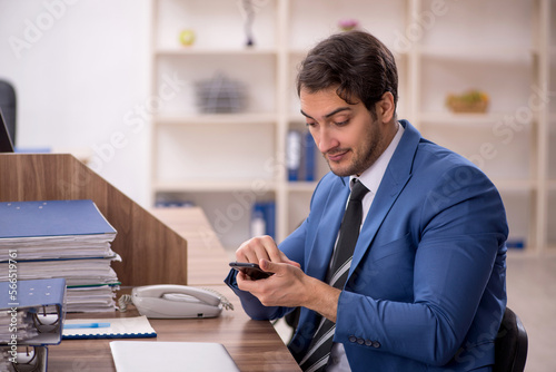 Young male employee working in the office