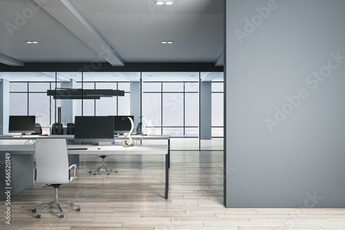 Contemporary coworking office interior with blank mock up place on wall  wooden and concrete details  window with city view and daylight. 3D Rendering.