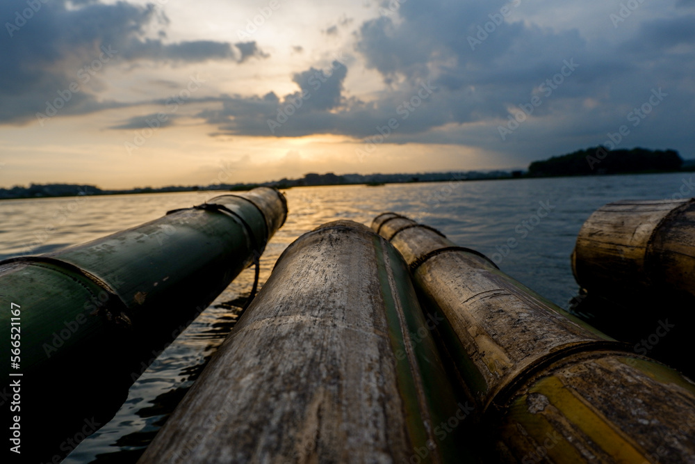 close up of floating bamboo with sunset background close up of floating bamboo with sunset background