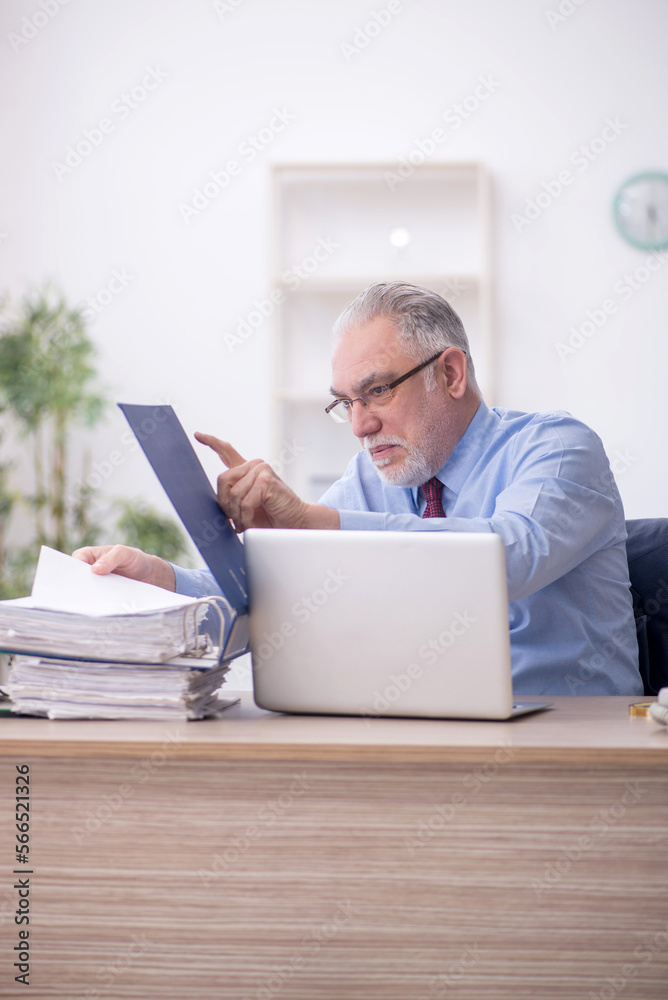 Two male colleagues working in the office Two male colleagues working in the office