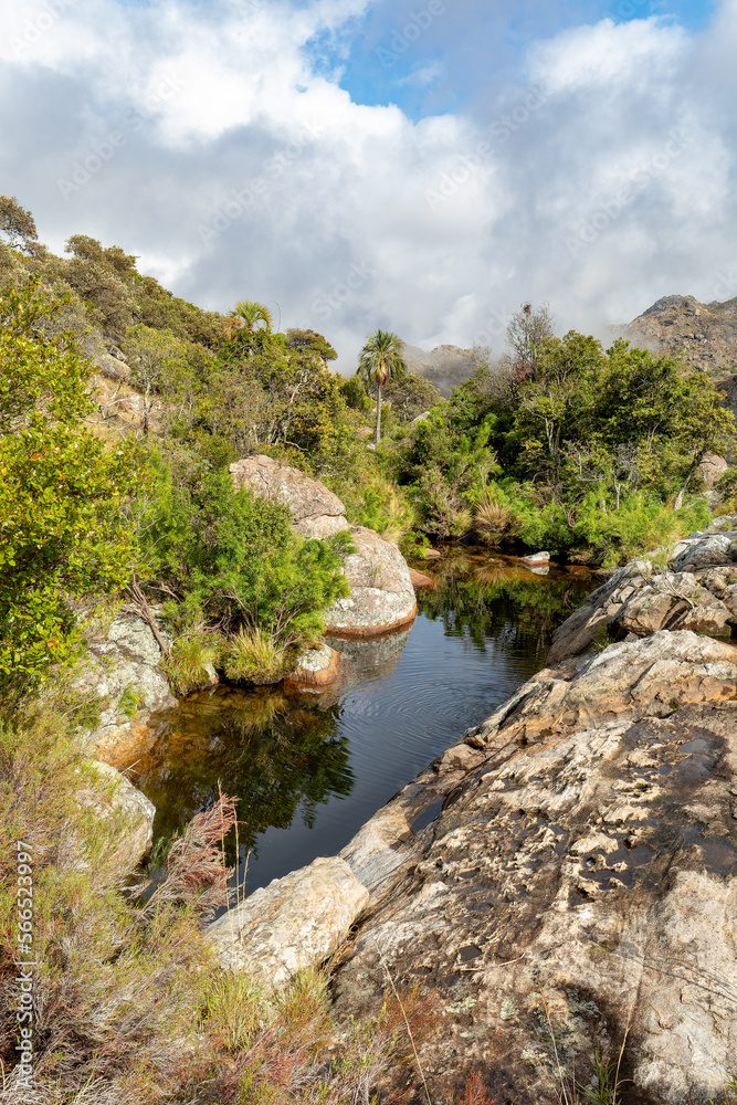 Andringitra national park, Haute Matsiatra region, Madagascar, beautiful mountain landscape with small river lagoon in valley. Hiking in Andringitra mountains. Madagascar wilderness landscape.