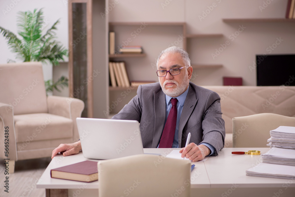 Old male employee working from home during pandemic Old male employee working from home during pandemic