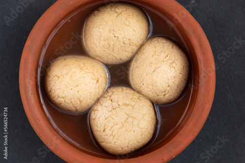 Indian Mithai Gurer Rosogolla Also Called Rasgulla, Rasagola, Rosgola, Roshogolla, Rossogolla, Rasbhari Or Rasbari Is Ball Shaped Dumpling Made Of Chhena, Sugar Syrup, Gud, Chena, Panir, Paneer, Gur photo