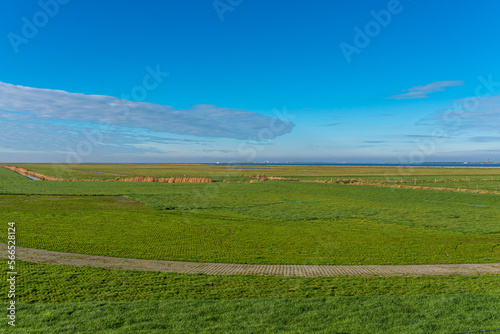 Dike foreland and salt marsh in Hagermarsch, Hilgenriedersiel on the East Frisian North Sea coast. There is a large floodplain in front of the dike on the wadden sea photo