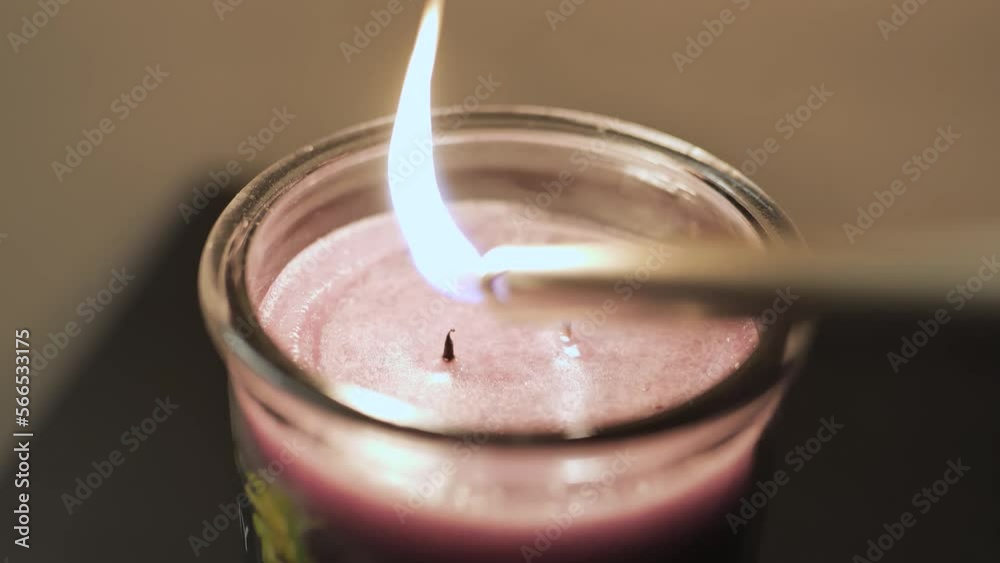 Lighting a candle with two wicks two fires one candle