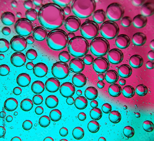 Blue pink mixed abstract background, bubbles in transparent liquid backdrop