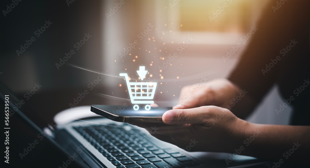 Businessman using a laptop with online shopping concept, marketplace website with virtual interface of online Shopping cart part of the network, Online shopping business with selecting shopping cart. - obrazy, fototapety, plakaty 