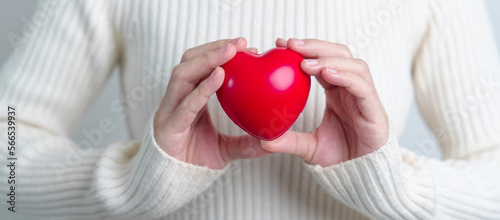 woman hand holding red heart shape. love, donor, world heart day, world health day and Insurance concepts photo