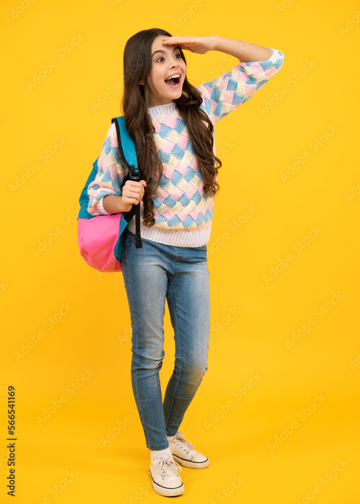 School teen girl in with backpack. Teenager student on isolated background. Kids learning, education, studying and knowledge.