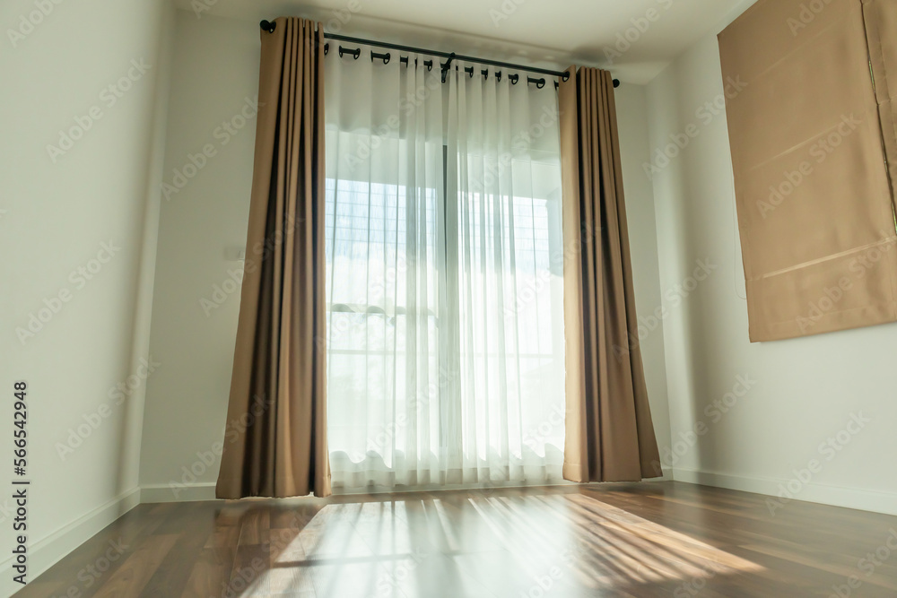 Obraz premium Curtain window interior decoration in living room on sunny day with sunlight