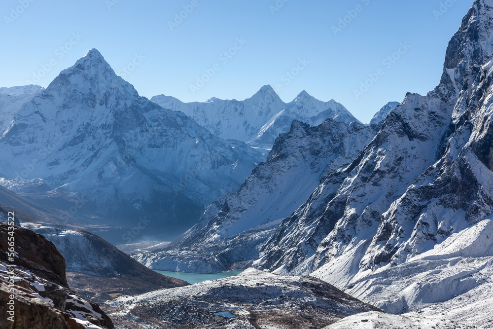 High mountain peaks in snow. Landscape in Nepal on the way to Cho La pass with moutn Ama Dablam.