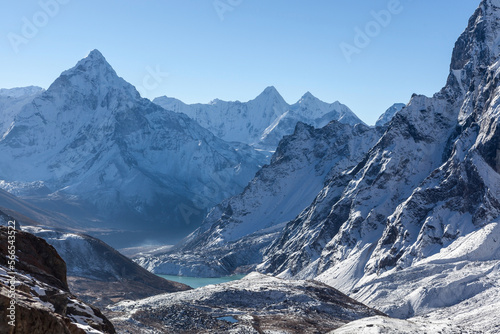 High mountain peaks in snow. Landscape in Nepal on the way to Cho La pass with moutn Ama Dablam. photo