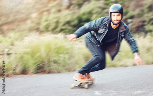 Sports  skateboard and man skating on road for fitness  exercise or wellness. Training  freedom and portrait of male skater moving with fast speed  skateboarding or riding outdoors for action workout