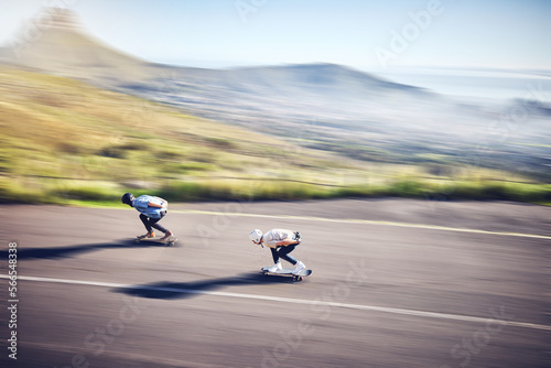 Skateboard  fast and road with people training  competition or danger  risk and adventure sports from above. Speed  motion and moving skater team on a street for youth energy  performance and action