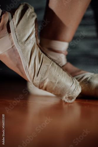 Ballerina. Legs of a ballerina on pointe shoes close-up on a background. Classic and modern. pointe shoes