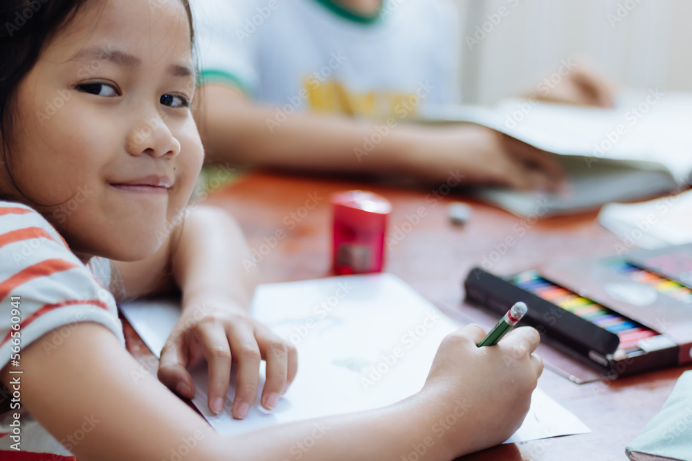 A girl is enjoying doing homework A girl is enjoying doing homework