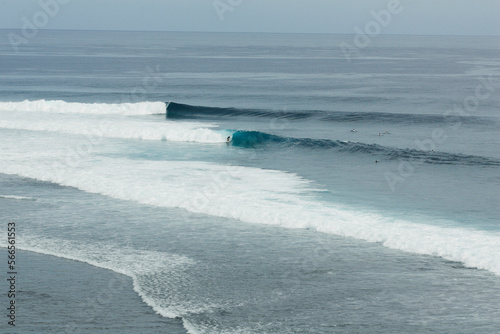 Aerial view of surfers riding waves off Tavarua, Fiji photo