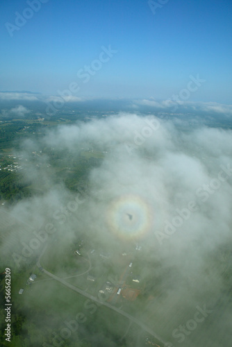 Shadow of an ultralight trike within a circular rainbow - known as photo