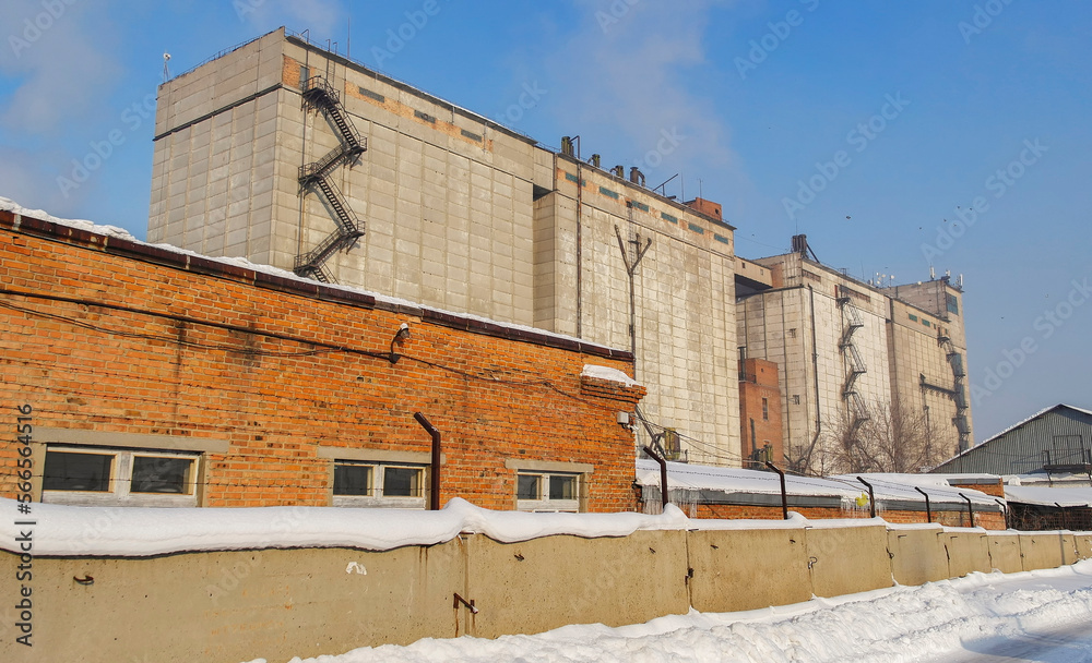 Elevator grain storage. kazakhstan (Ust-Kamenogorsk). Old industrial building. Building for storing and drying grain. Old elevator. Winter. December 2022