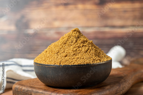 Powdered cumin spice. Cumin spice in bowl on wooden background. Dry spice concept. close up