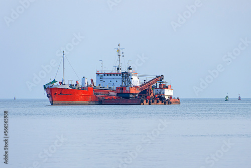 Cargo ship on loading transport ship, cargo sea vessel, conceptual technology, freight transport by forwarder mast