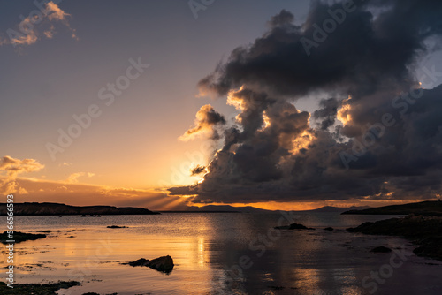 Sunrise from rhoscolyn Beach looking to Snowdonia photo