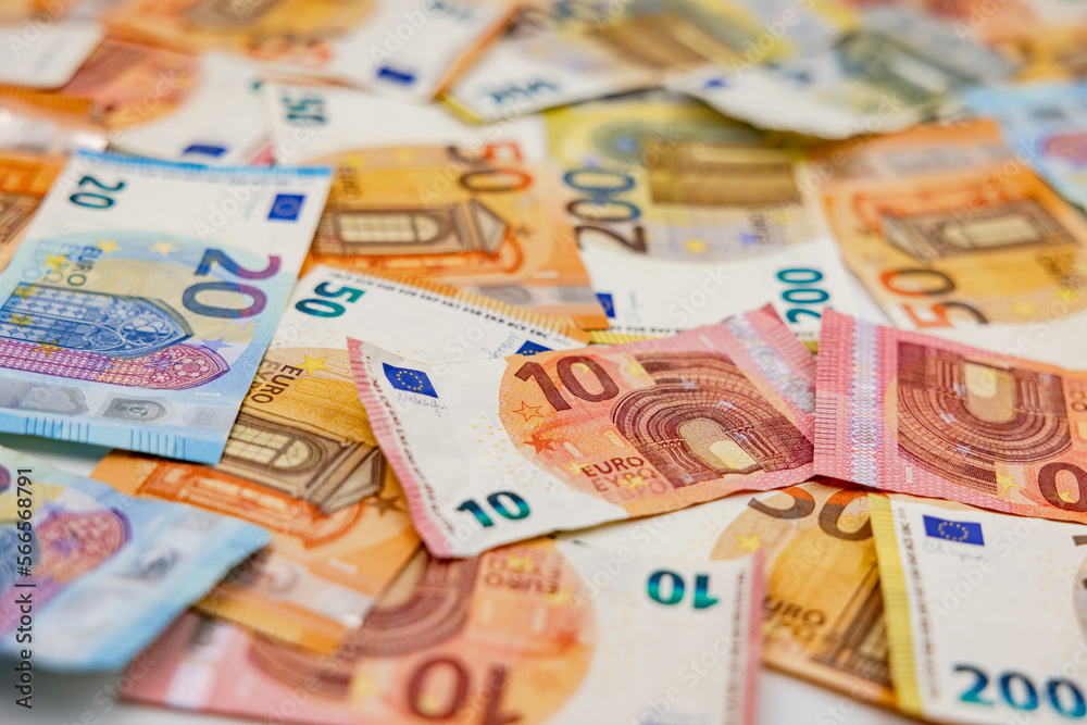 Many euro banknotes as a background with a low depth of field show richness and abundance Many euro banknotes as a background with a low depth of field show richness and abundance