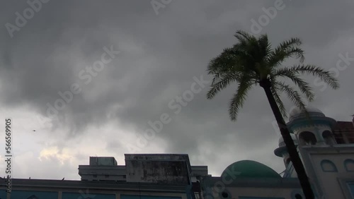 Stormy weather above Mosque in Sylhet Bangladesh, pigeon birds flying photo