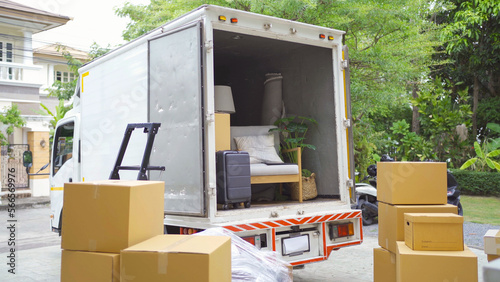 Truck car moving house for customers, delivering boxes and furniture. Vehicle transportation. Shipping and packaging business occupation service company. People lifestyle.