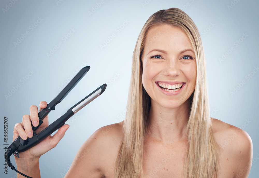 Face portrait, hair straightener and beauty of woman in studio isolated on gray background. Balayage, haircare and happy female model with flat iron product for hairstyle, grooming or salon treatment Face portrait, hair straightener and beauty of woman in studio isolated on gray background. Balayage, haircare and happy female model with flat iron product for hairstyle, grooming or salon treatment